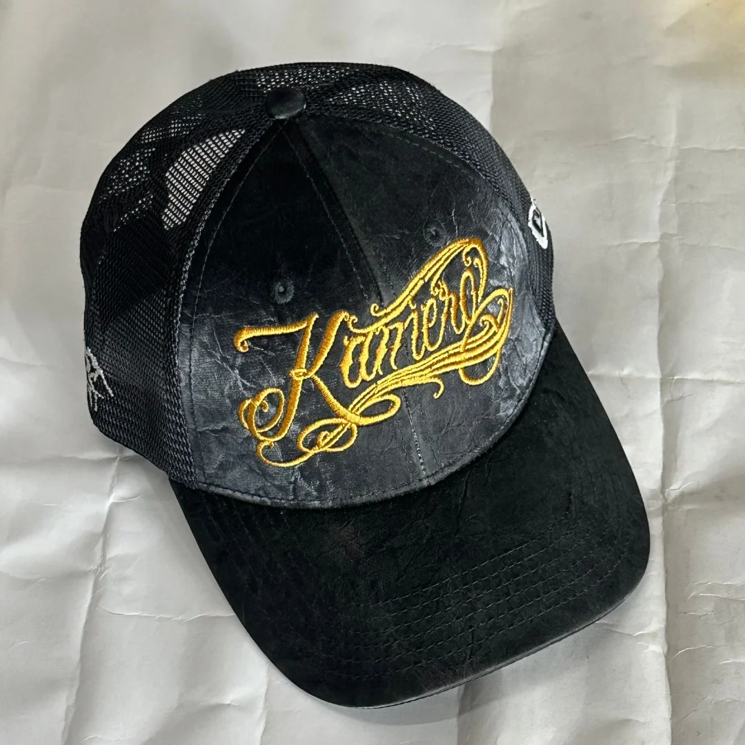 KAMERO CURSIVE LEATHER TRUCKER